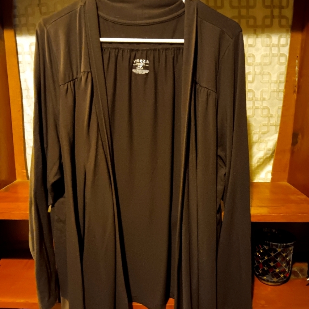 Open, long, different length brown sweater.